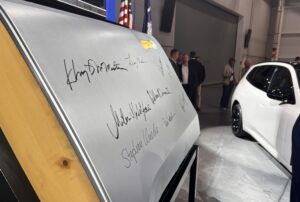 BMW and elected officials signed the first door to officially roll off the new press shop assembly line. (Photo/Ross Norton)