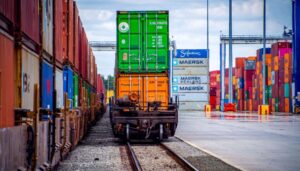 Cargo containers are transferred at Inland Port Greer, a key rail hub connecting Upstate manufacturers to the Port of Charleston and global markets. (Photo/SC Ports/Craig Lee)